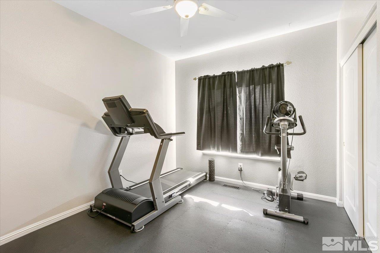 9625 Marble Creek Court Reno, NV 89506 - Photo 26 of 40 a room with gym equipment and windows