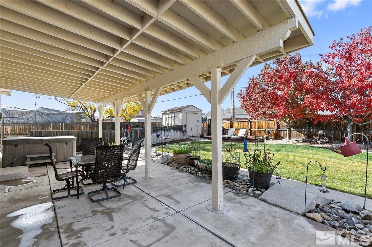 9625 Marble Creek Court Reno, NV 89506 - Photo 30 of 40 a patio with a table and chairs and potted plants