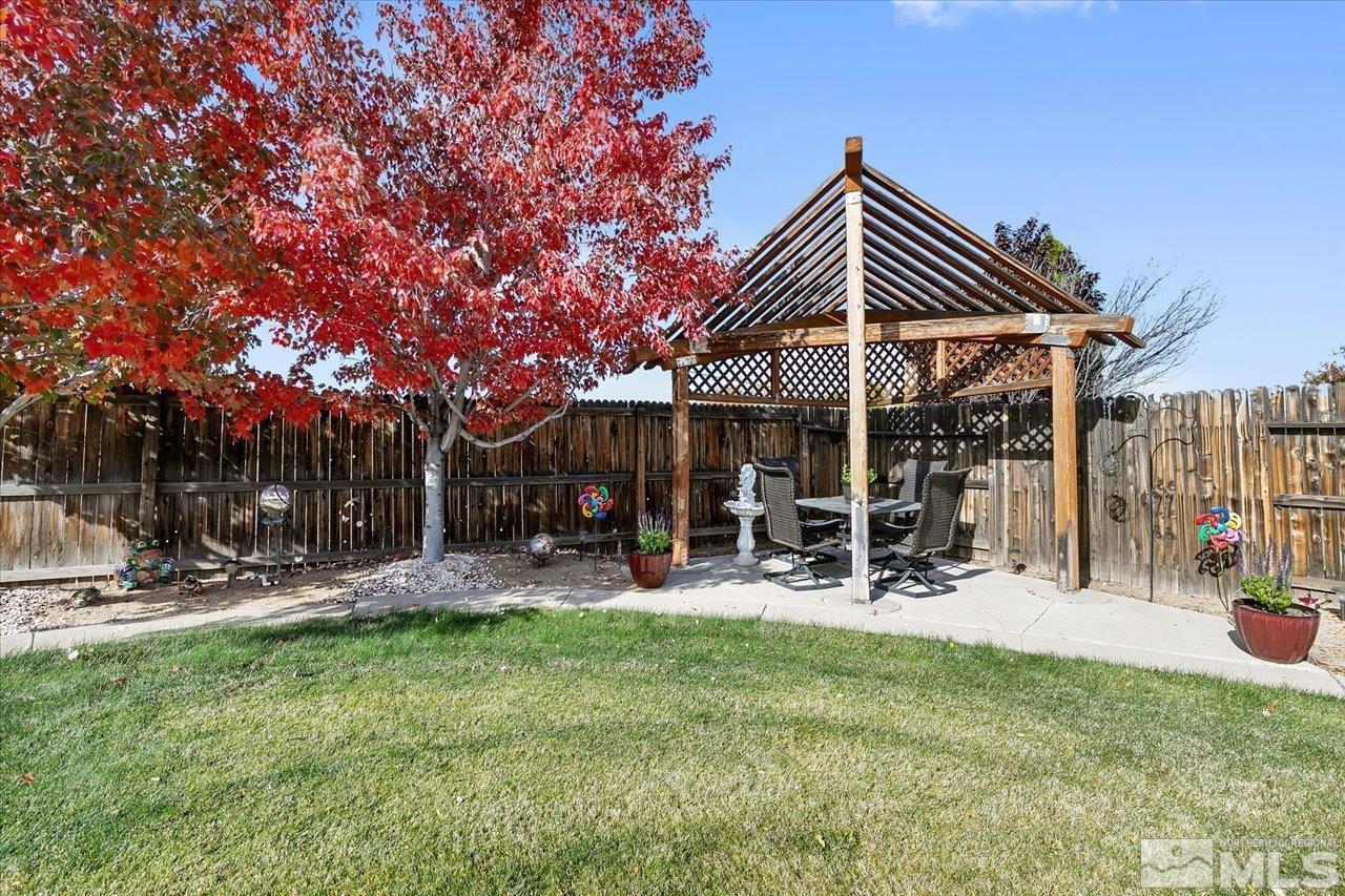 9625 Marble Creek Court Reno, NV 89506 - Photo 31 of 40 a view of a chairs and table in a yard