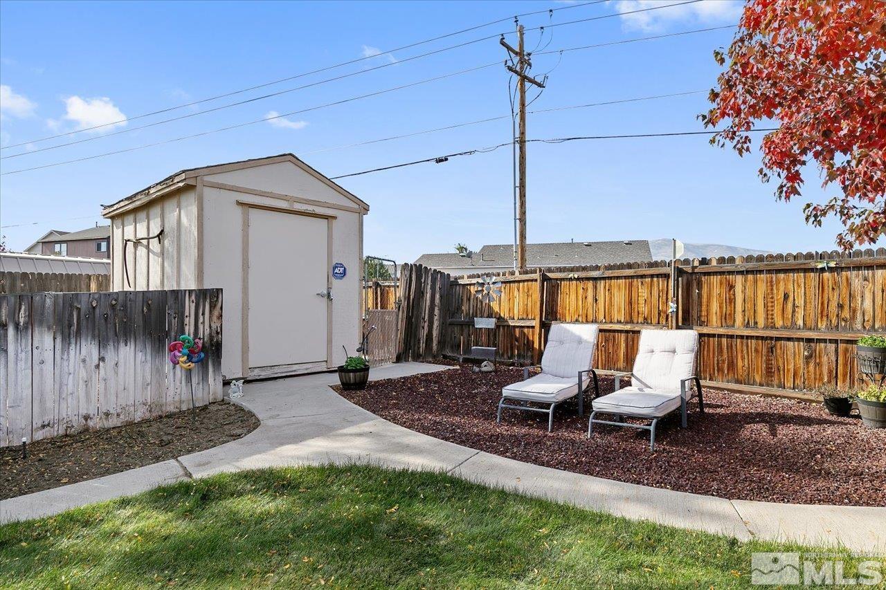 9625 Marble Creek Court Reno, NV 89506 - Photo 32 of 40 a view of a chair and table in the backyard