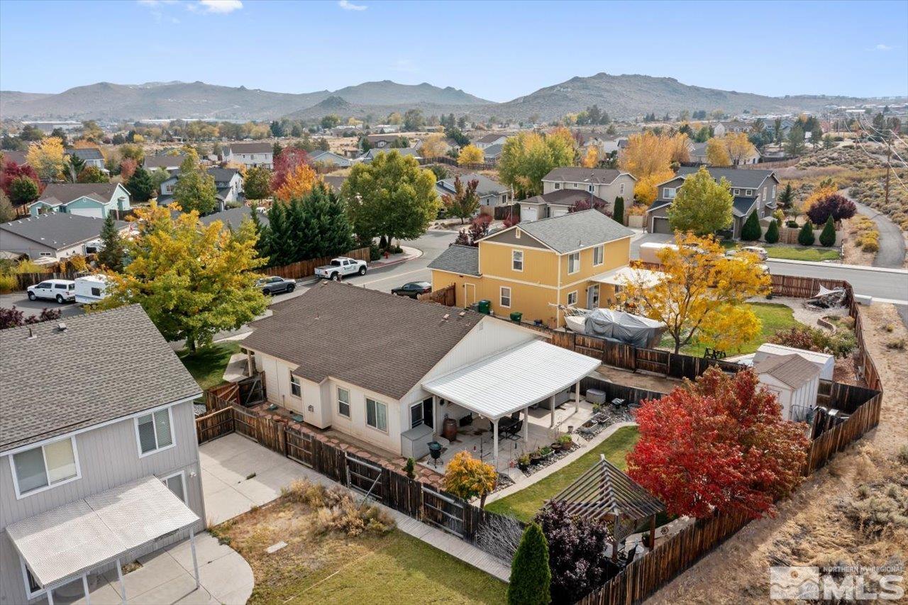 9625 Marble Creek Court Reno, NV 89506 - Photo 34 of 40 an aerial view of a house with a mountain