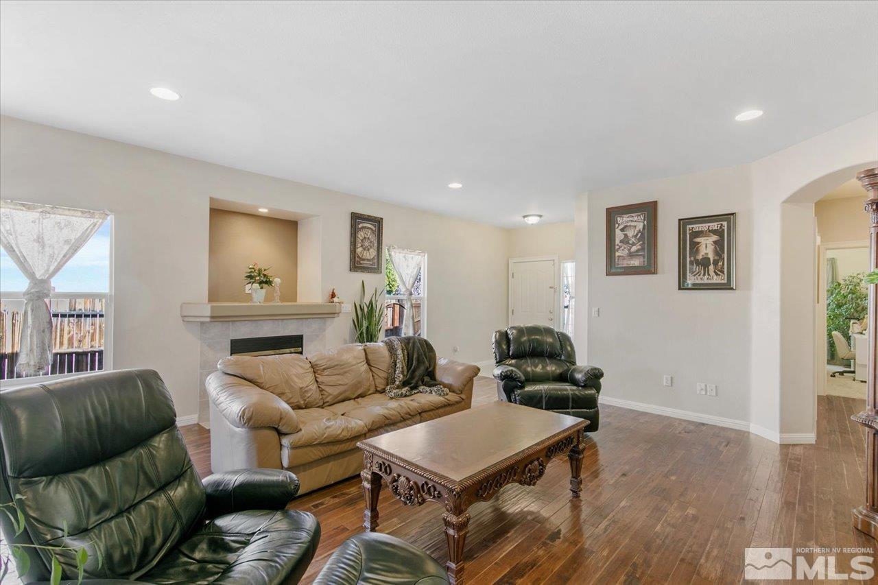 9625 Marble Creek Court Reno, NV 89506 - Photo 5 of 40 a living room with furniture and a wooden floor