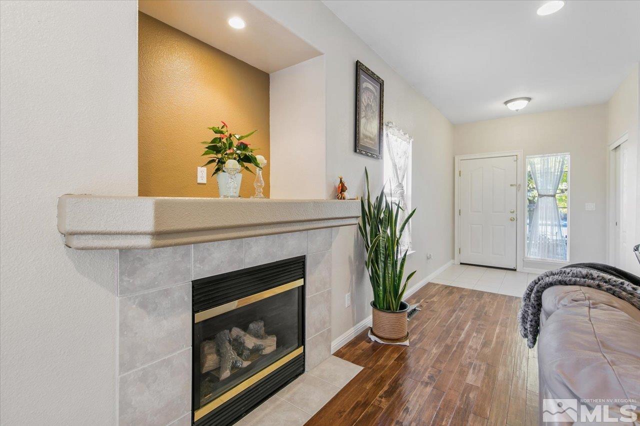 9625 Marble Creek Court Reno, NV 89506 - Photo 6 of 40 a living room with furniture and a fireplace