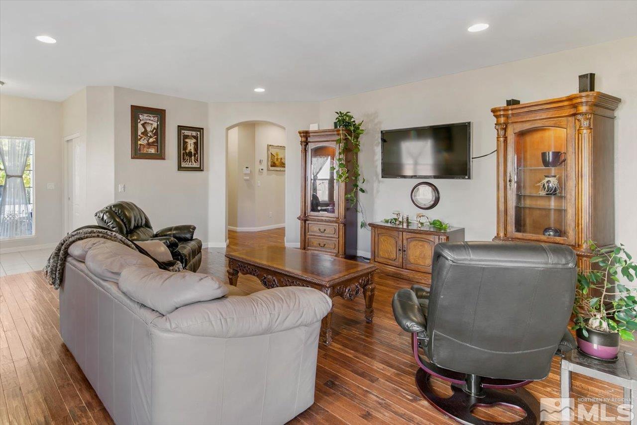9625 Marble Creek Court Reno, NV 89506 - Photo 9 of 40 a living room with furniture and a flat screen tv