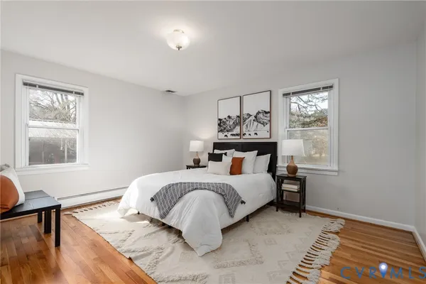 a bed room with a bed and a window