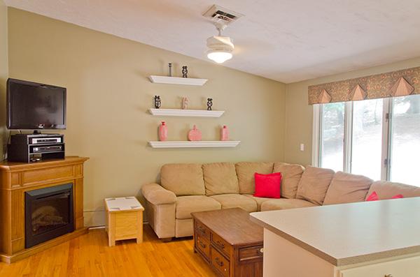 587 Edmands Road Framingham, MA 01701 - Photo 11 of 30 a living room with furniture and a fireplace