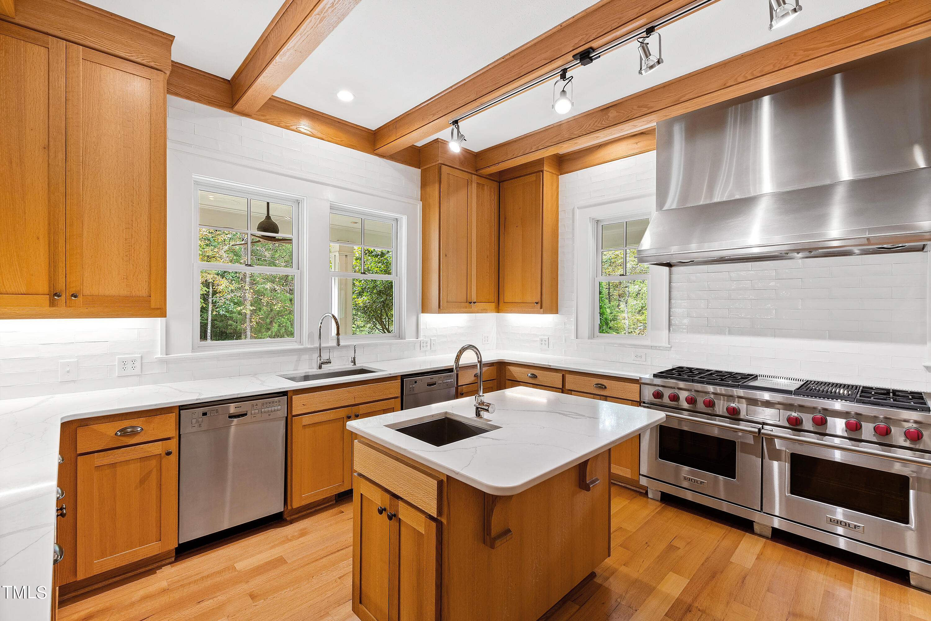 621 Sugarberry Road Chapel Hill, NC 27514 - Photo 20 of 85 a kitchen with a stove a sink and a microwave