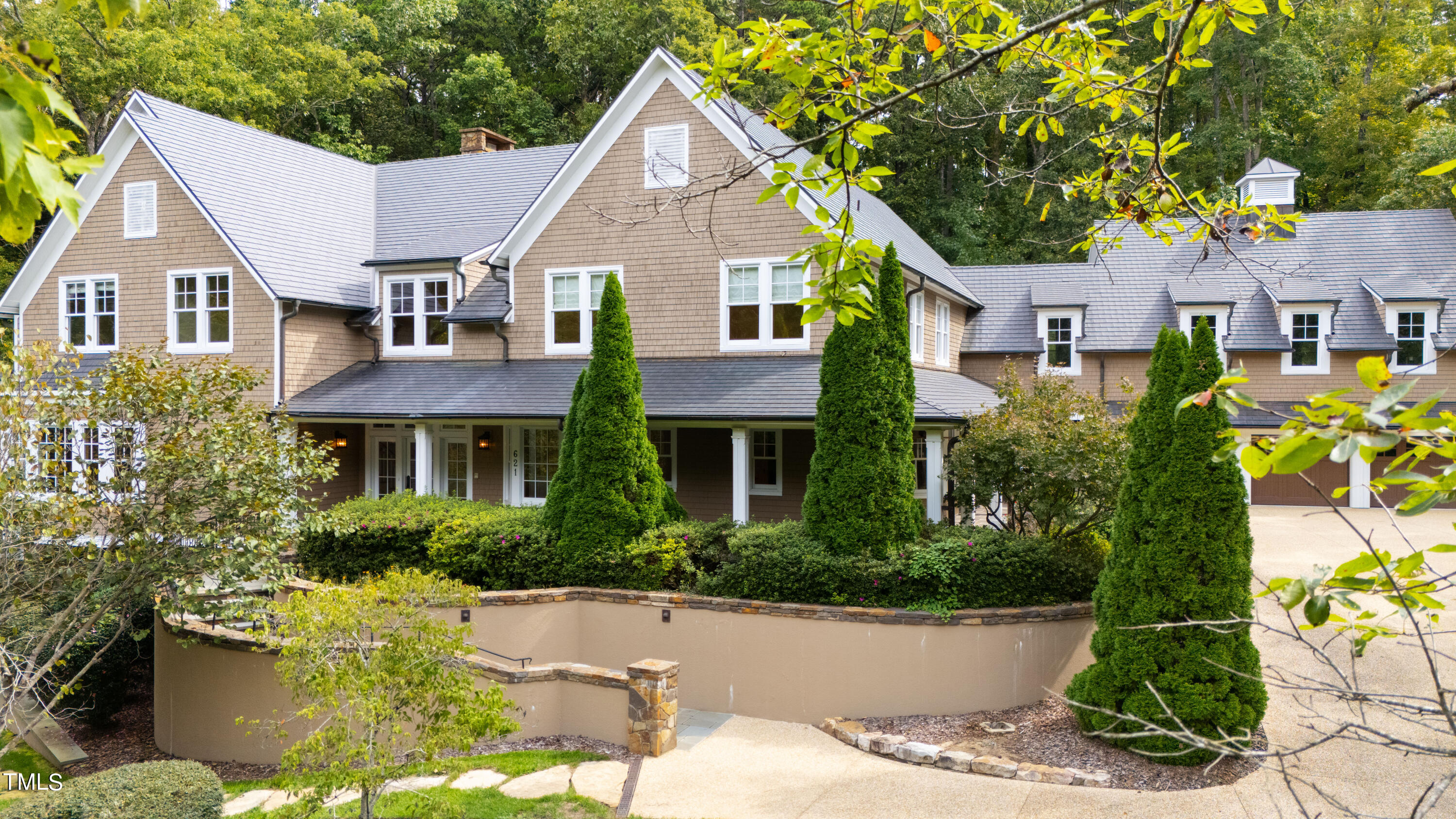 621 Sugarberry Road Chapel Hill, NC 27514 - Photo 2 of 85 a front view of a house with a yard and trees