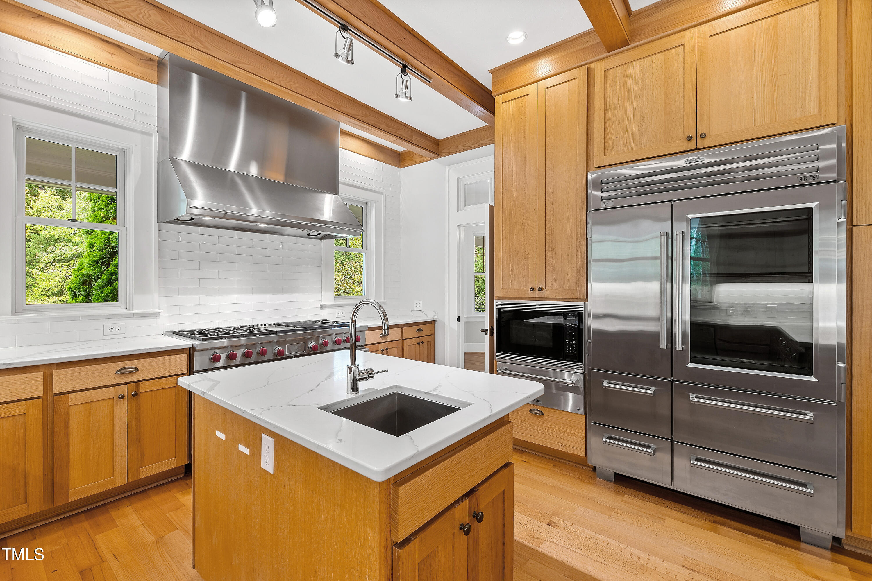 621 Sugarberry Road Chapel Hill, NC 27514 - Photo 23 of 85 a kitchen with a sink stove and refrigerator