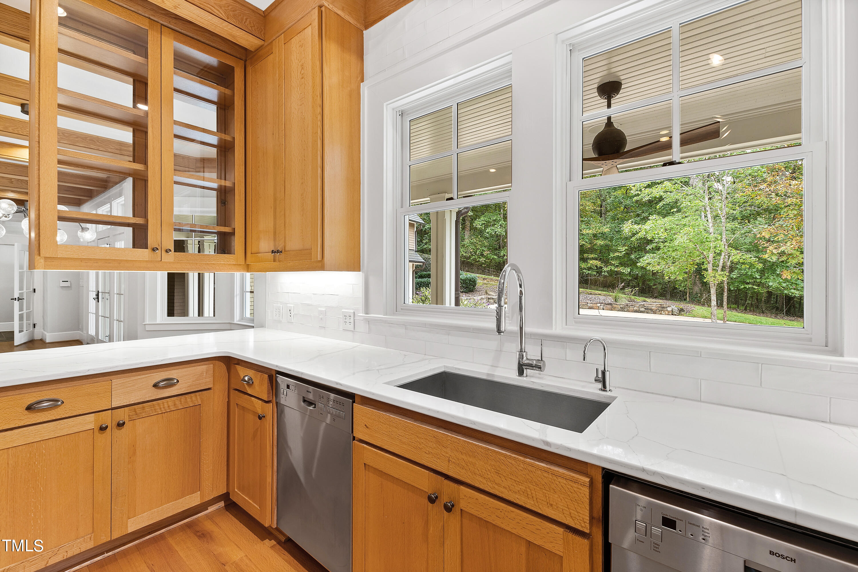621 Sugarberry Road Chapel Hill, NC 27514 - Photo 24 of 85 a kitchen with a sink and large window