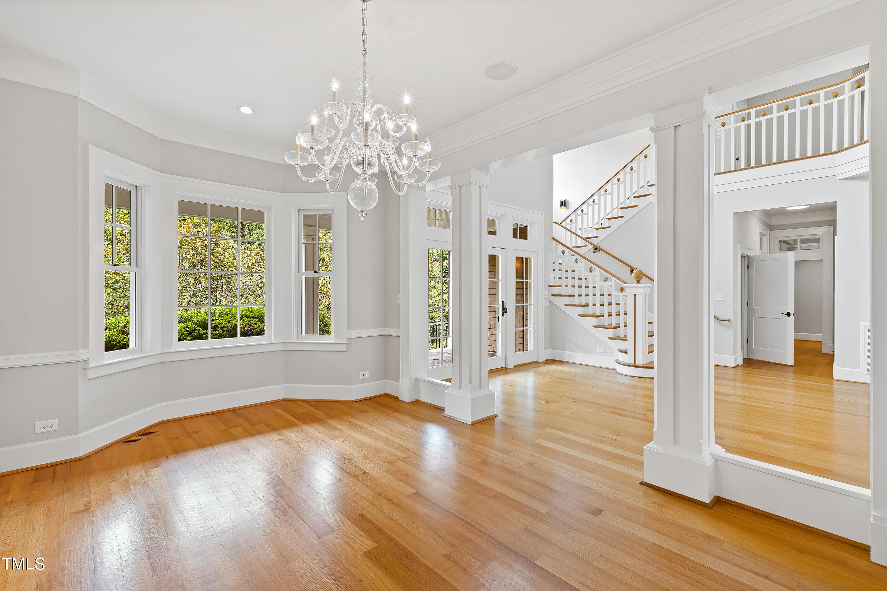 621 Sugarberry Road Chapel Hill, NC 27514 - Photo 25 of 85 a view of an empty room with wooden floor and a window