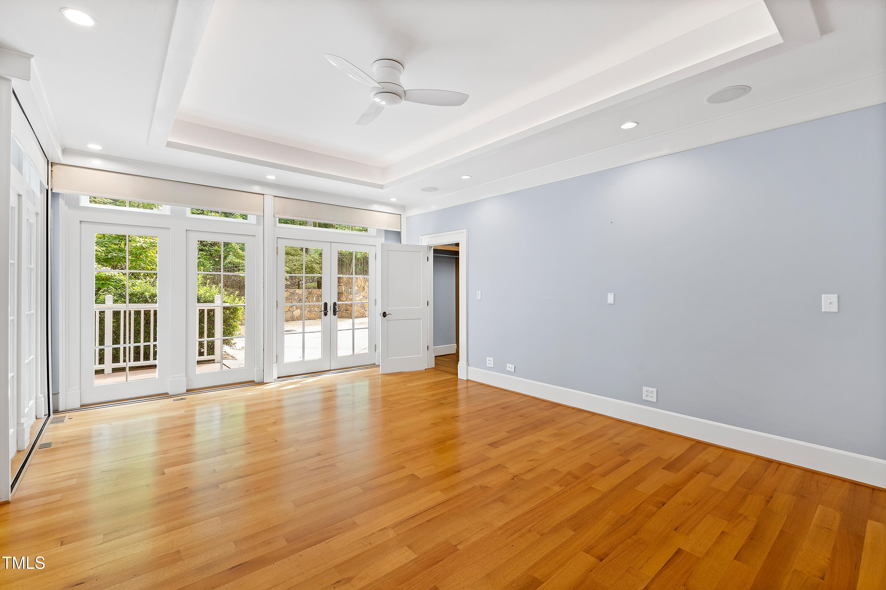 621 Sugarberry Road Chapel Hill, NC 27514 - Photo 31 of 85 a view of an empty room with wooden floor and a window