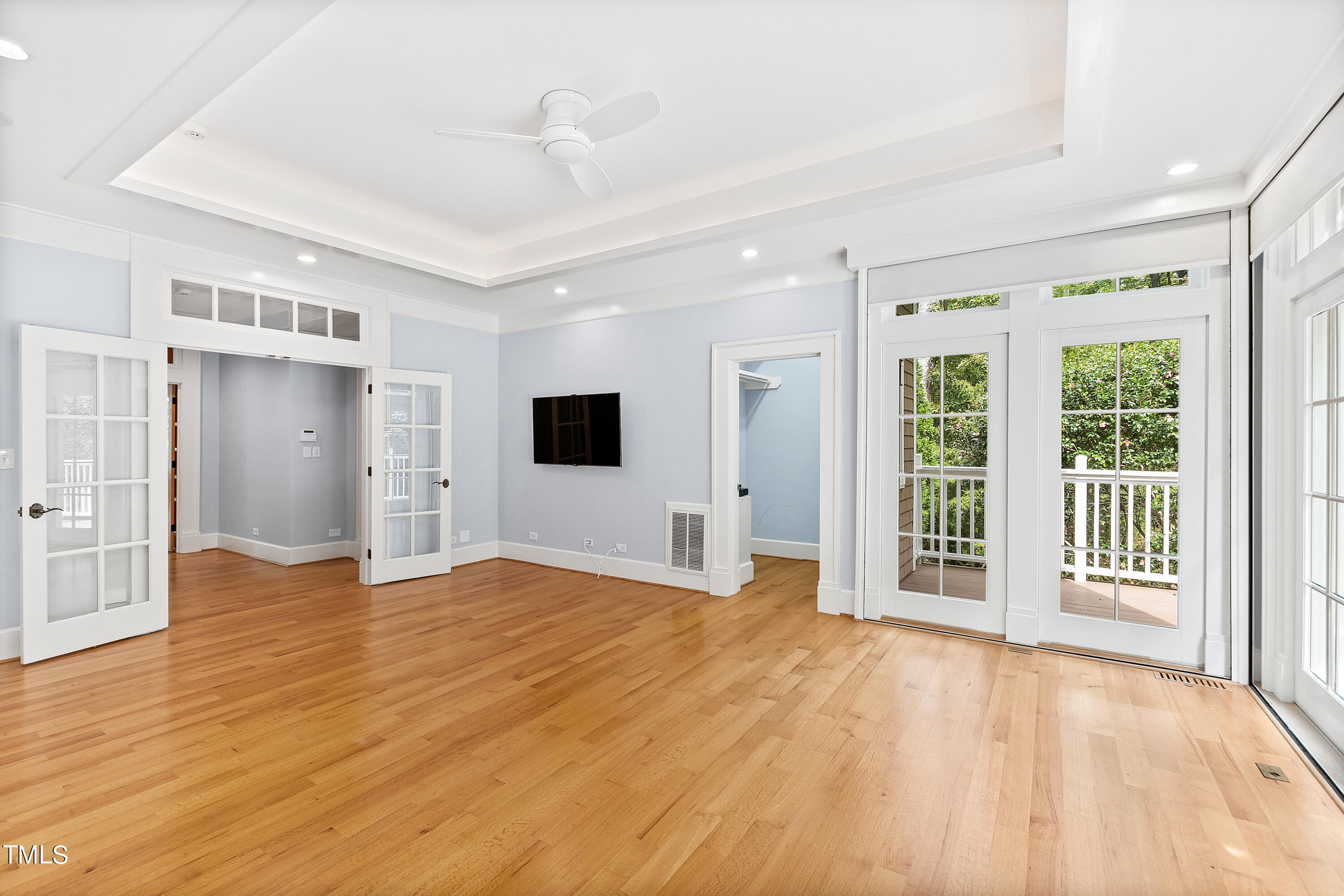 621 Sugarberry Road Chapel Hill, NC 27514 - Photo 33 of 85 a view of an empty room with wooden floor and a window
