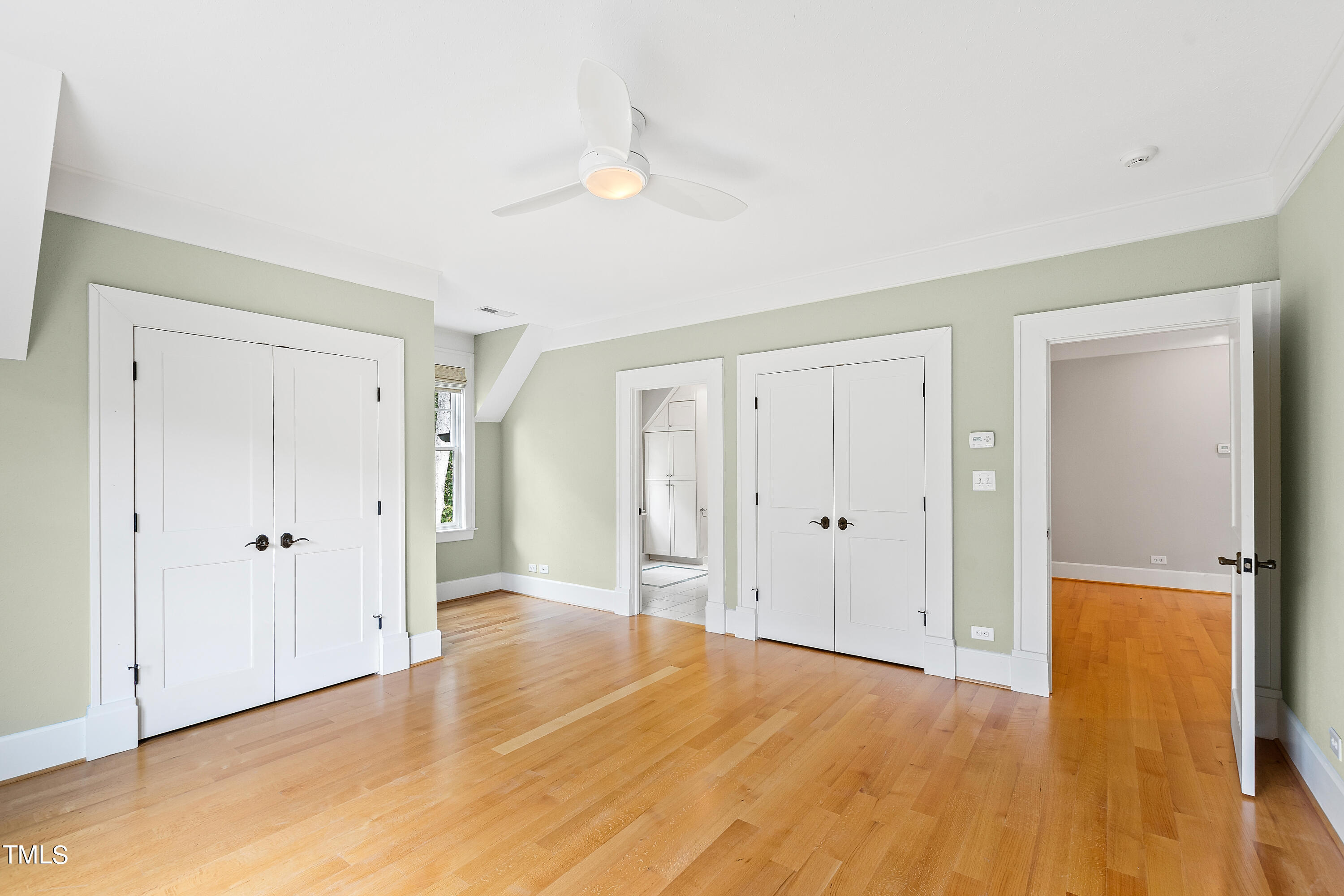 621 Sugarberry Road Chapel Hill, NC 27514 - Photo 43 of 85 a view of an empty room with wooden floor and a bathroom