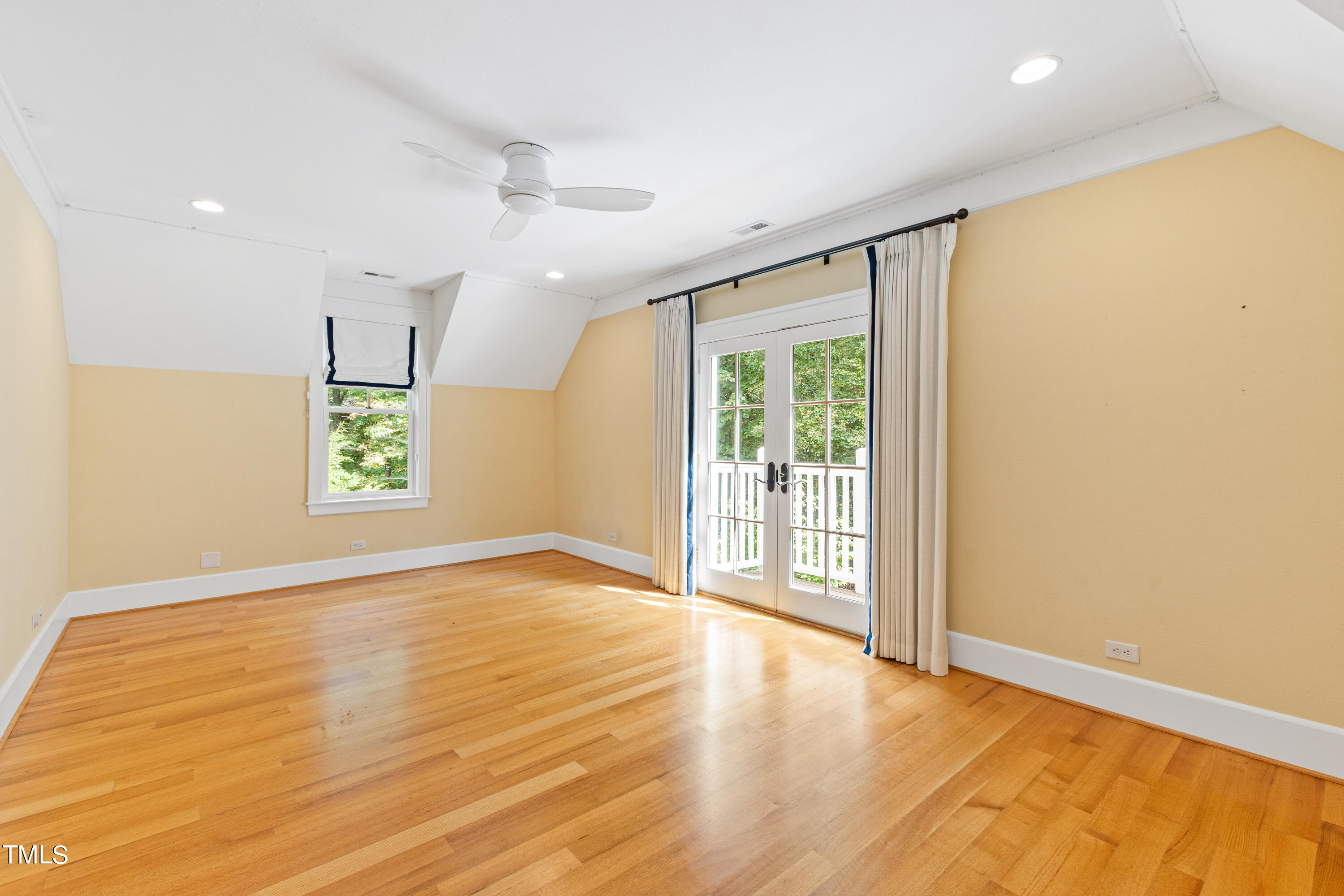 621 Sugarberry Road Chapel Hill, NC 27514 - Photo 48 of 85 a view of an empty room with a window and wooden floor