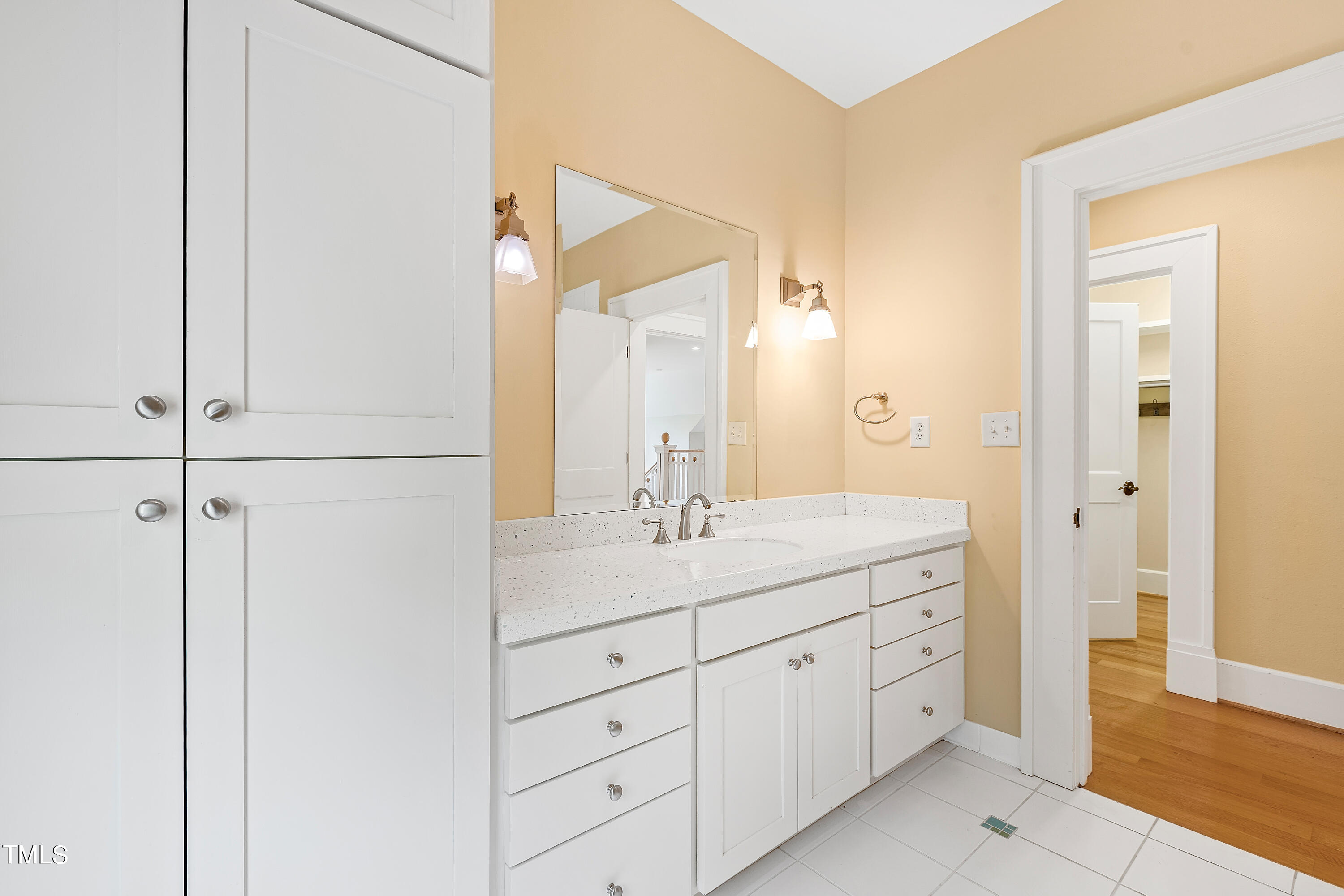 621 Sugarberry Road Chapel Hill, NC 27514 - Photo 50 of 85 a bathroom with a granite countertop sink and a mirror