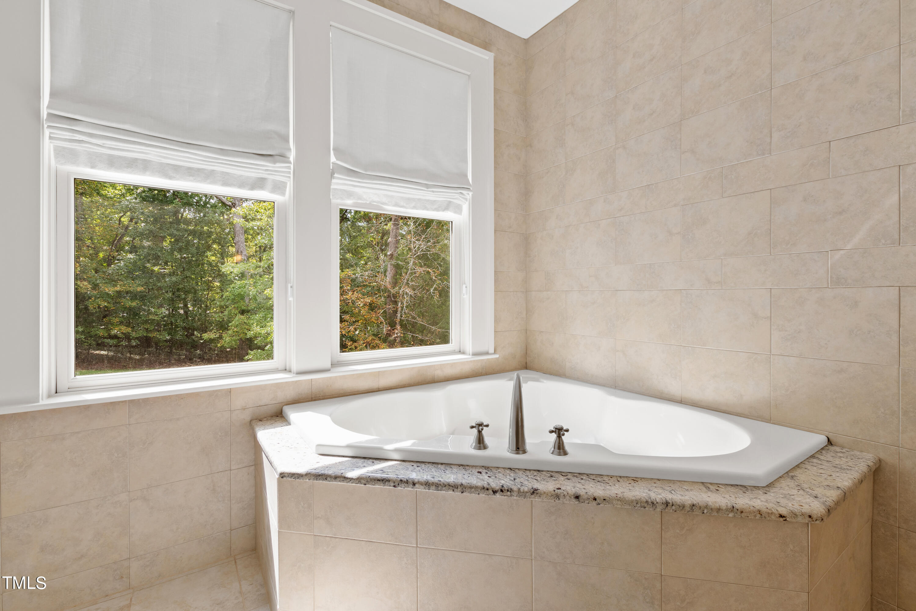 621 Sugarberry Road Chapel Hill, NC 27514 - Photo 54 of 85 a white bath tub sitting in a bathroom