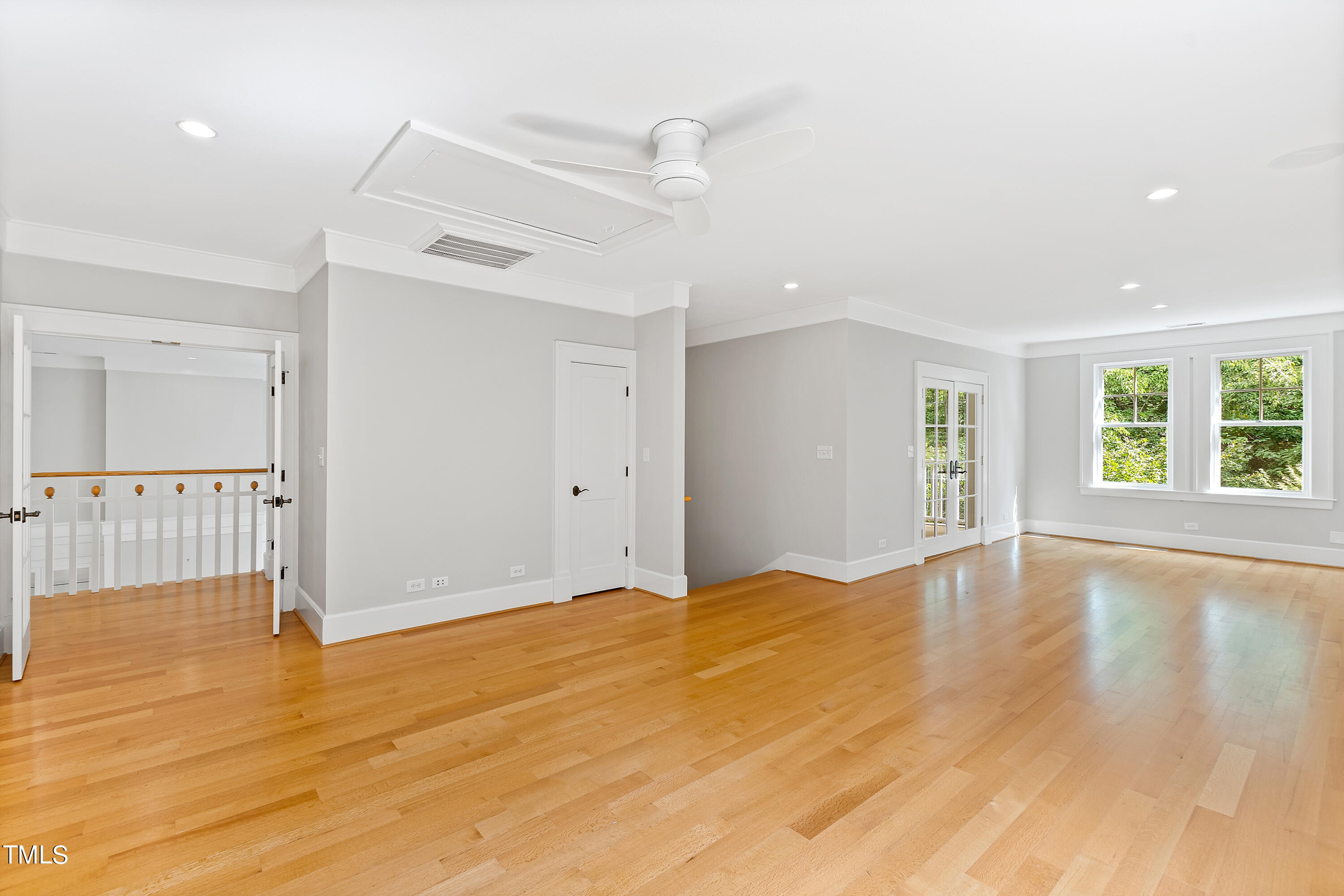 621 Sugarberry Road Chapel Hill, NC 27514 - Photo 55 of 85 a view of an empty room with wooden floor and a window