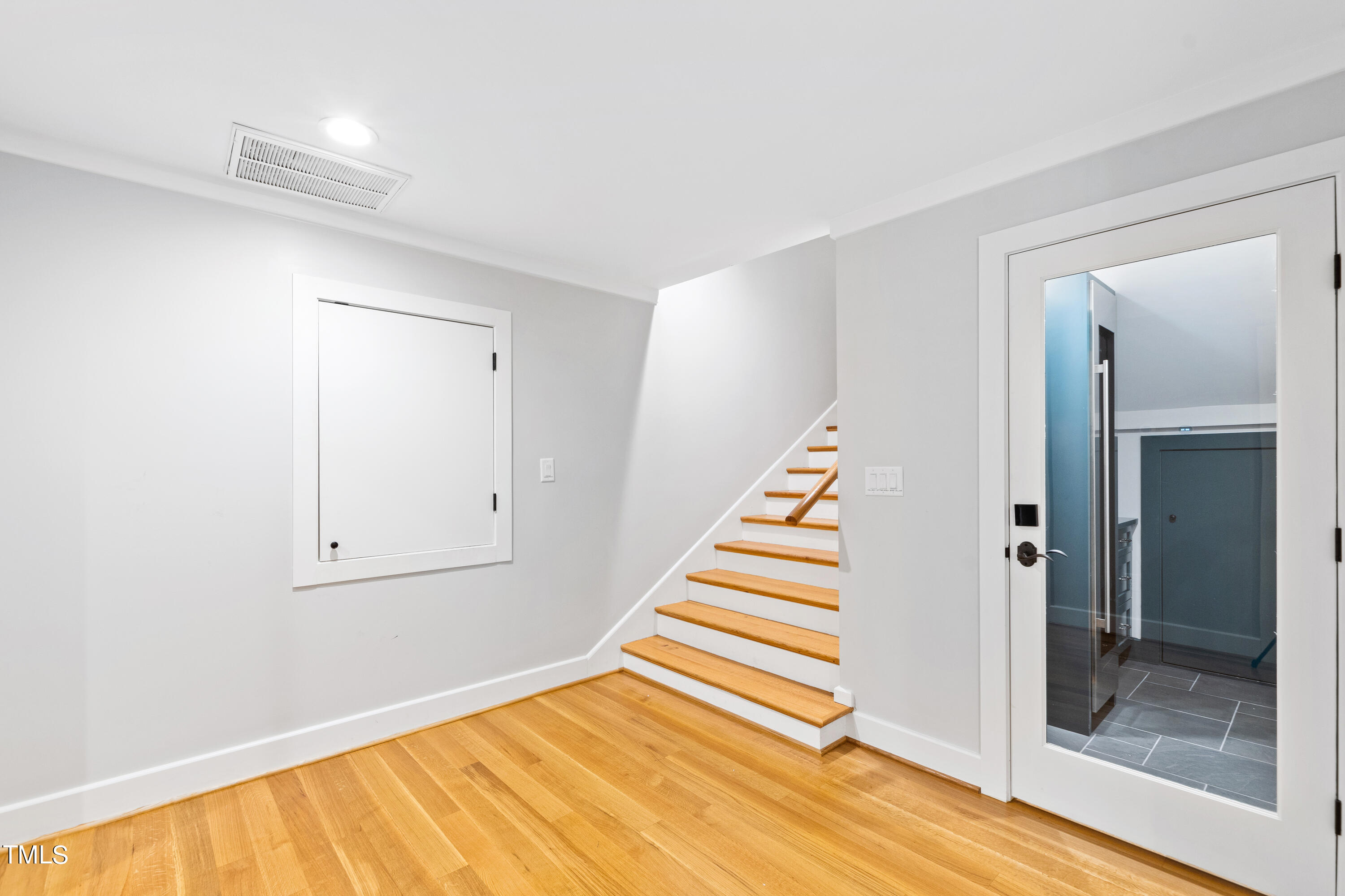621 Sugarberry Road Chapel Hill, NC 27514 - Photo 64 of 85 a view of a room with wooden floor and white walls