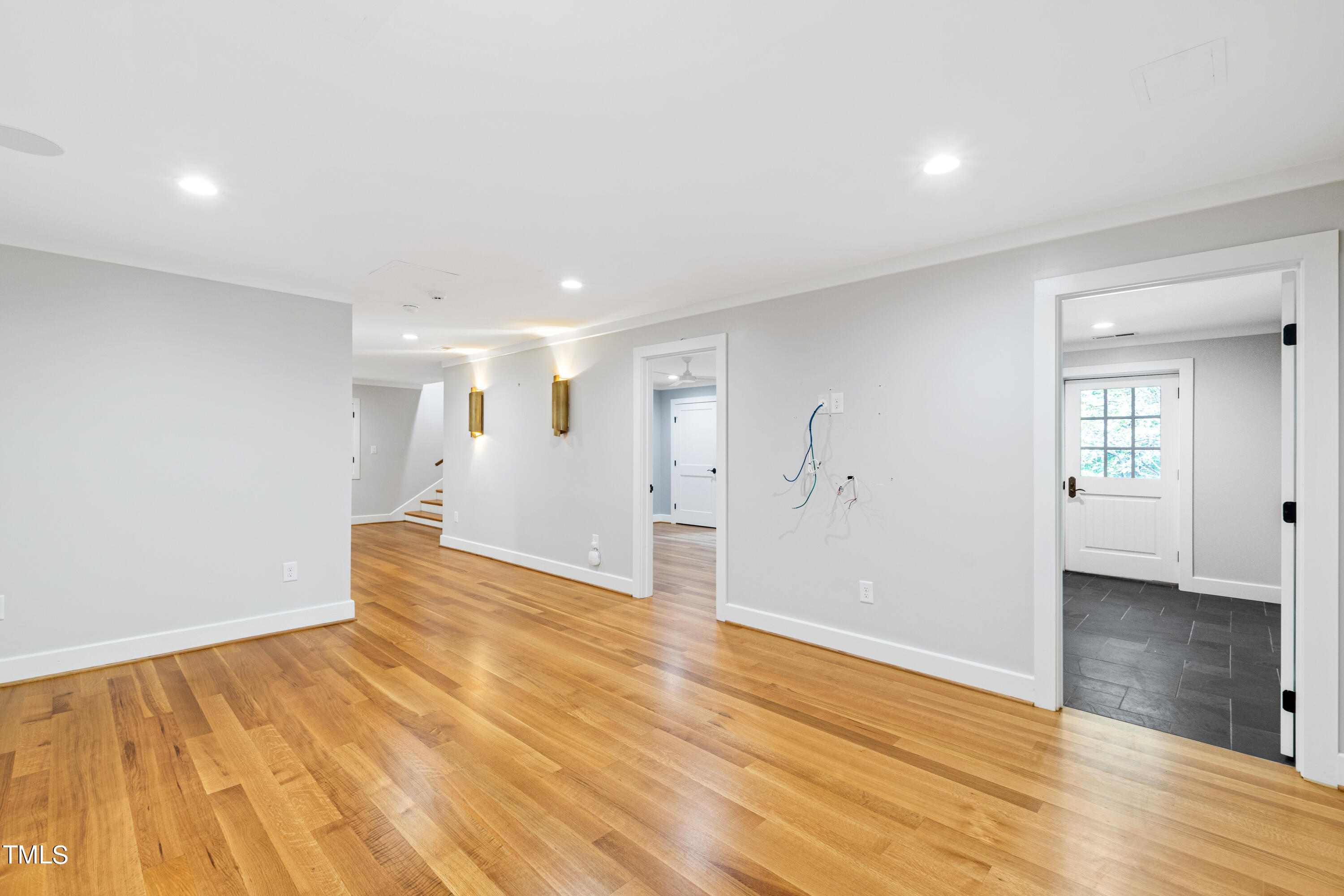 621 Sugarberry Road Chapel Hill, NC 27514 - Photo 66 of 85 a view of an empty room with wooden floor and a window