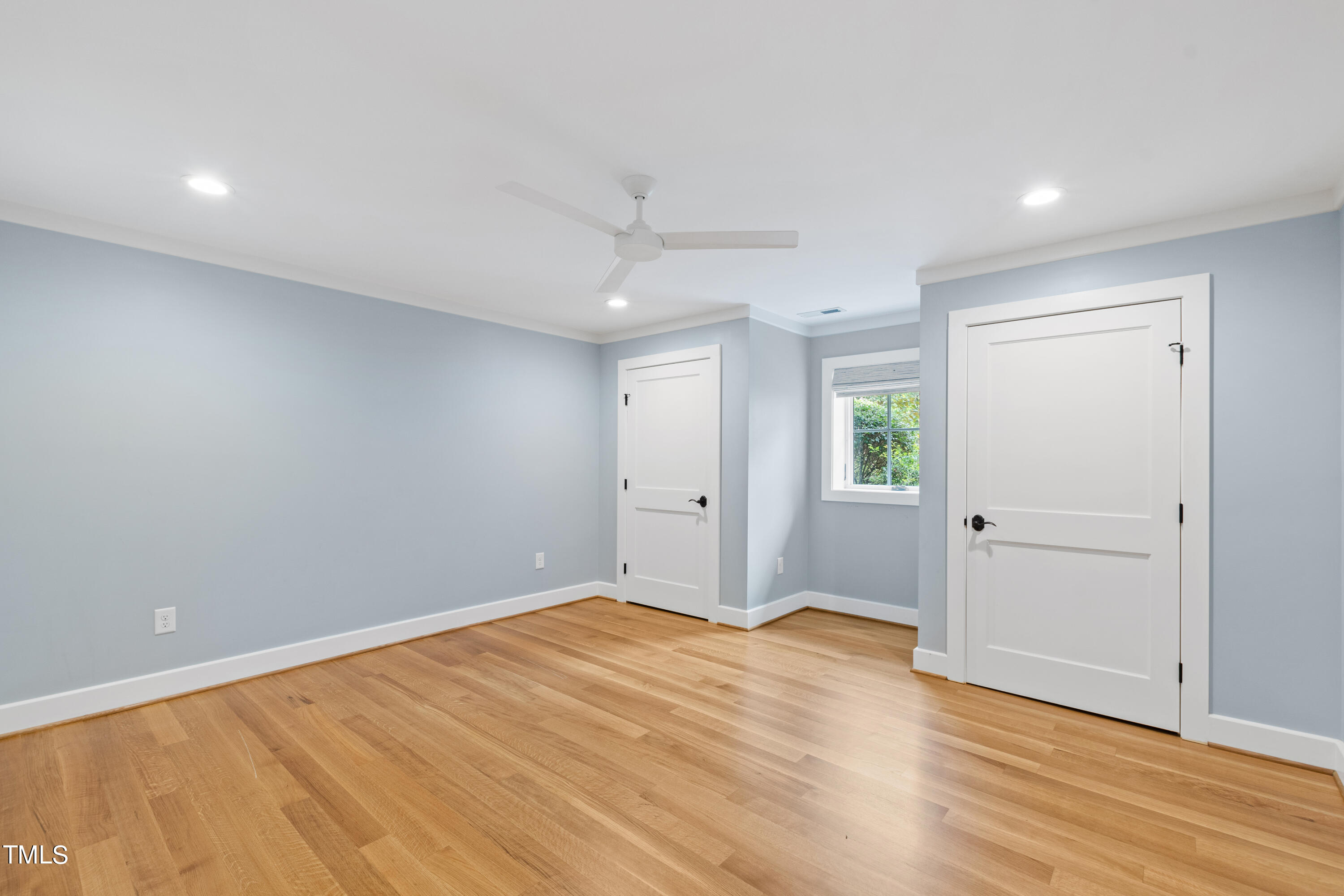 621 Sugarberry Road Chapel Hill, NC 27514 - Photo 69 of 85 a view of an empty room with wooden floor and a window