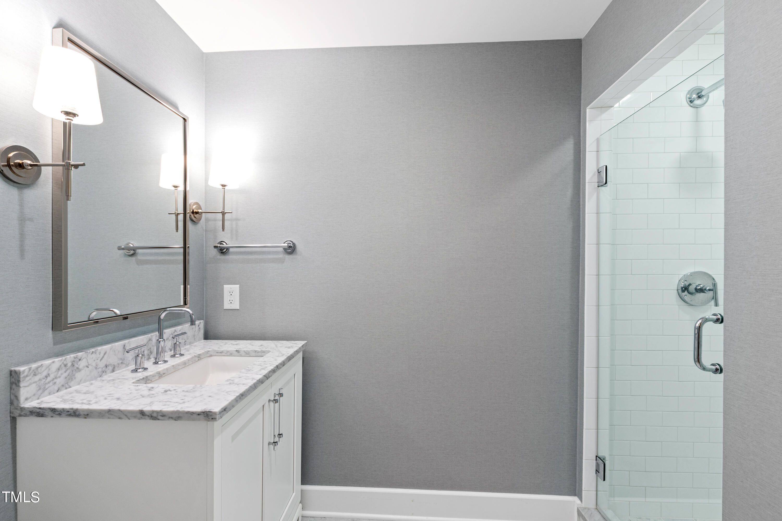 621 Sugarberry Road Chapel Hill, NC 27514 - Photo 71 of 85 a bathroom with a granite countertop sink and a mirror