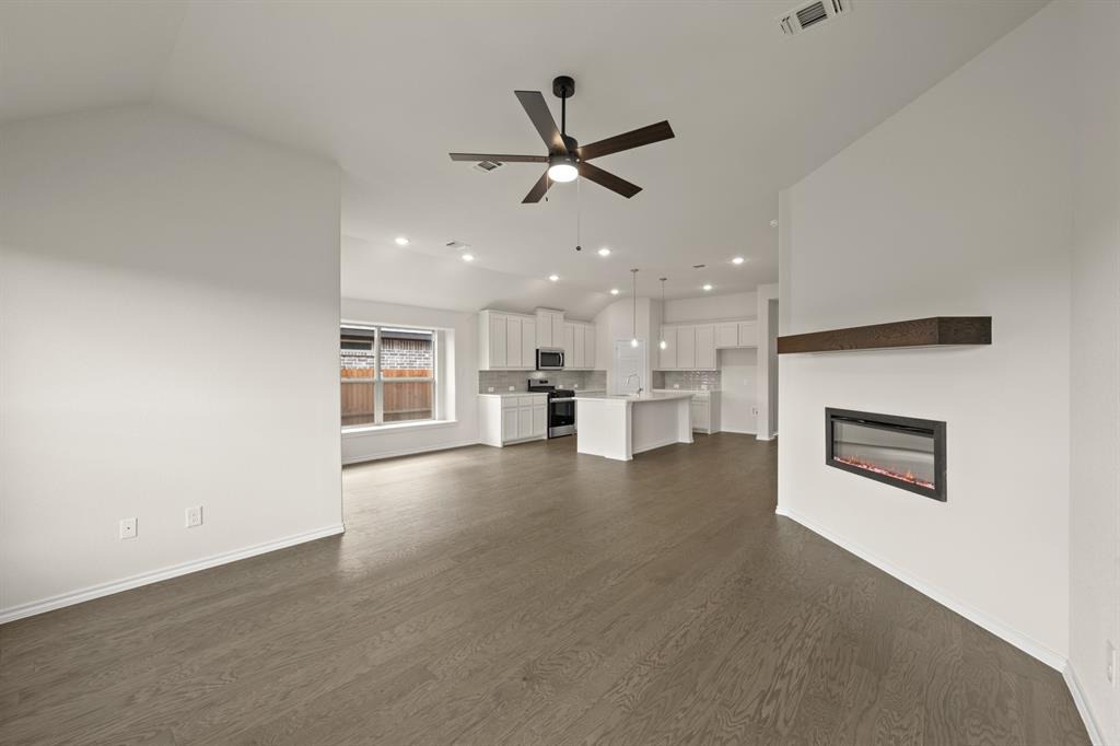 10809 Rothland Street Crowley, TX 76036 - Photo 12 of 30 a view of a kitchen with a sink and a stove top oven
