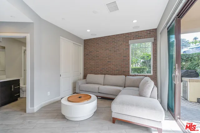 a view of entryway with a floor to ceiling window and an outdoor view