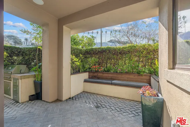 a kitchen with a sink and a microwave