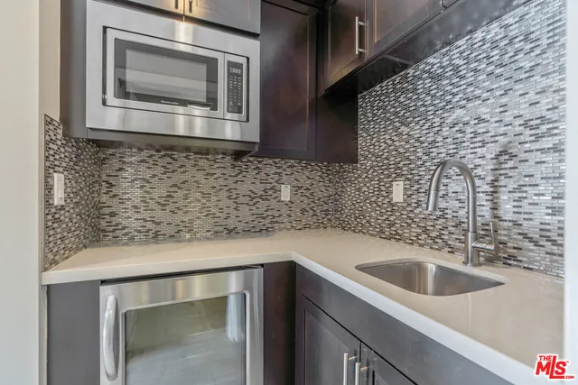 a view of an empty room and closet area