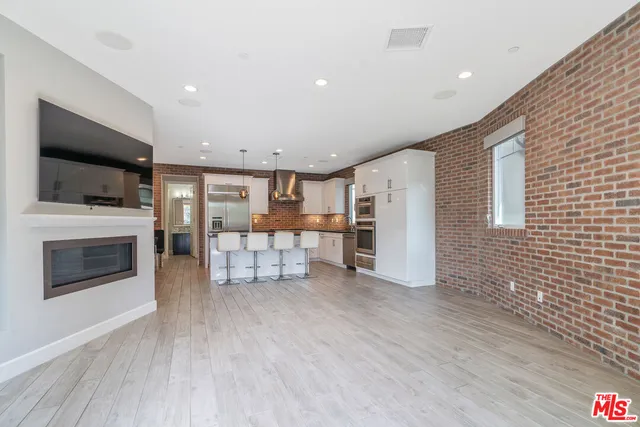 a view of room with window and ceiling fan