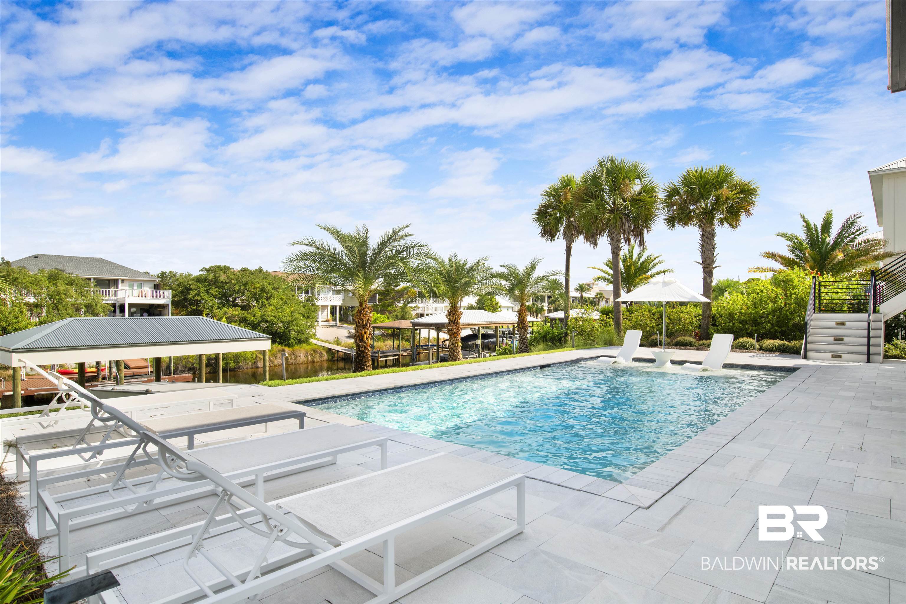 30239 Canal Court Orange Beach, AL 36561 - Photo 62 of 70 View of pool featuring a patio and stairs