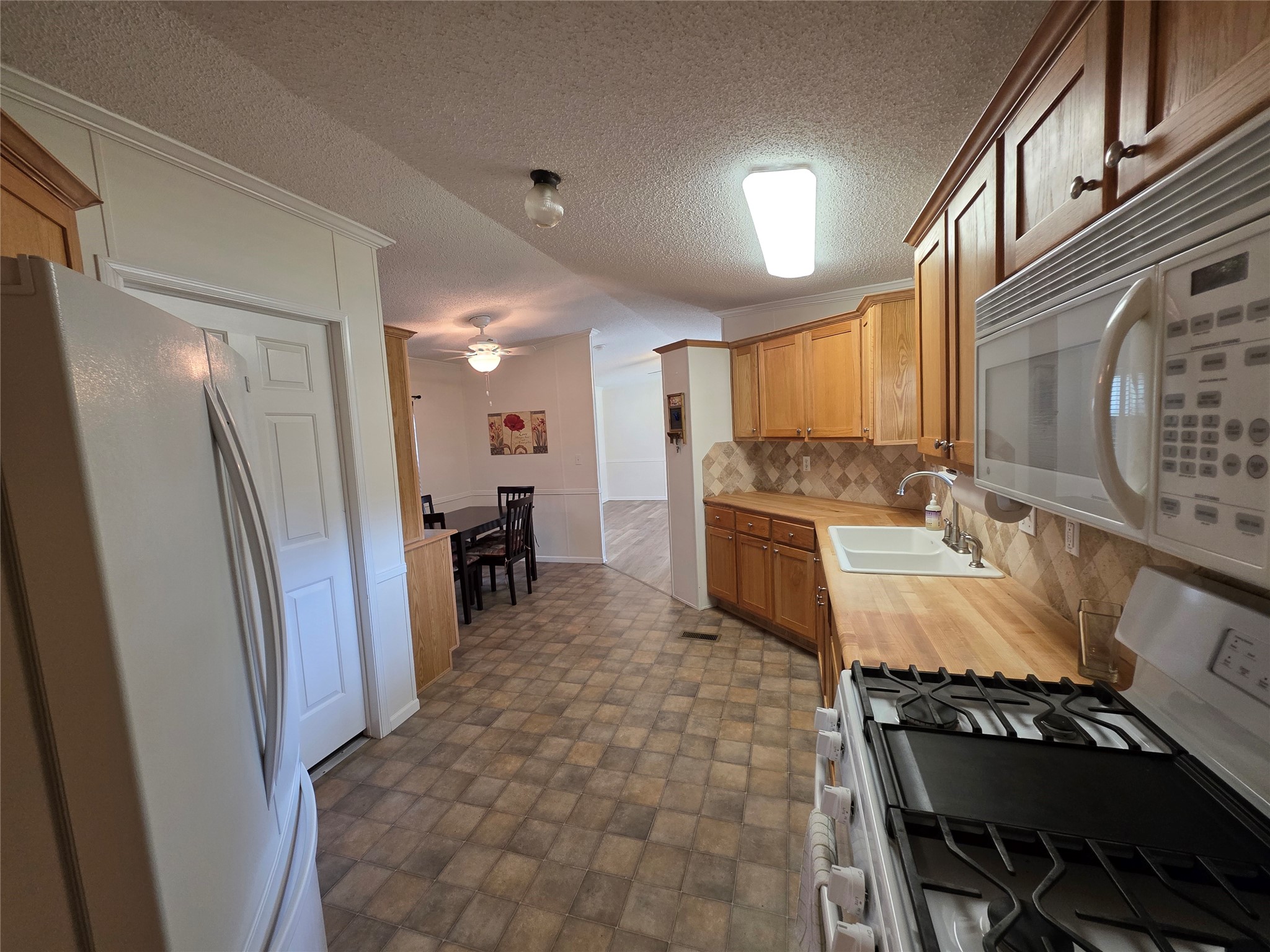 70 Montego Way Point Blank, TX 77364 - Photo 33 of 41 a kitchen with a sink appliances and cabinets
