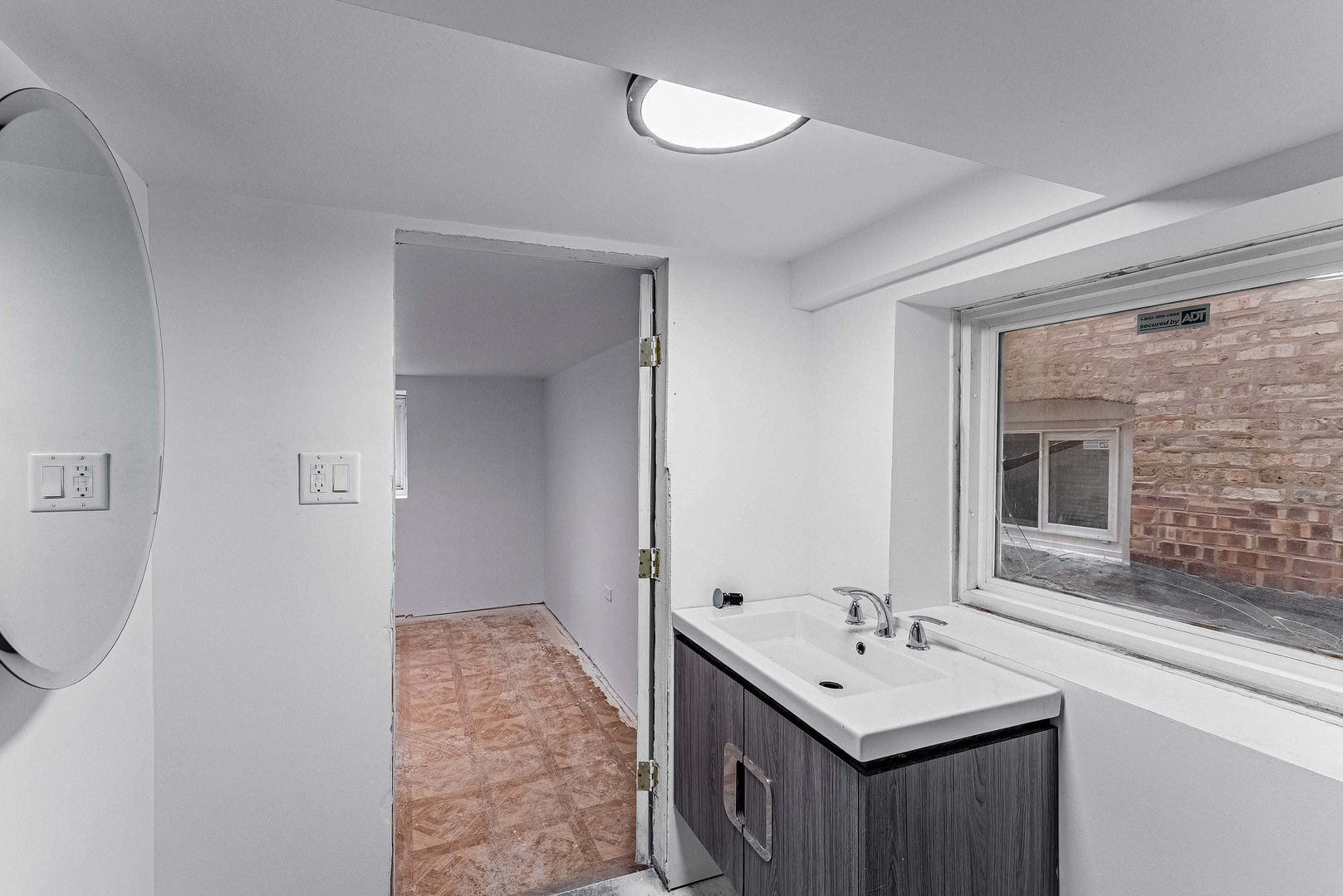 1330 Ridgeland Avenue Berwyn, IL 60402 - Photo 21 of 23 a bathroom with a sink and a mirror