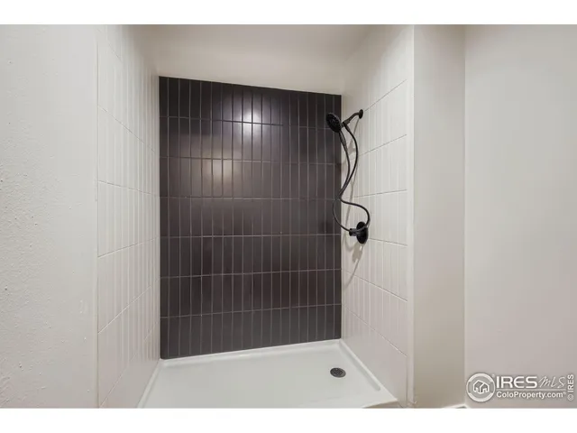 a view of an empty room and closet area