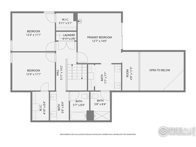 a picture of a wall with a white building