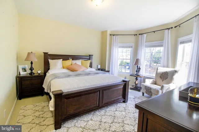 a living room with furniture fireplace and flat screen tv