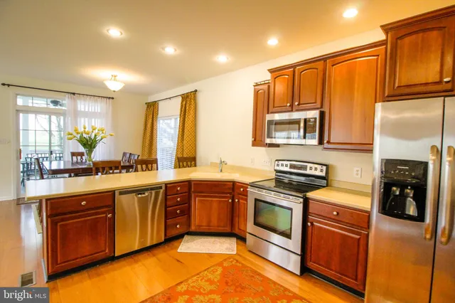 a bedroom with a bed couch and window