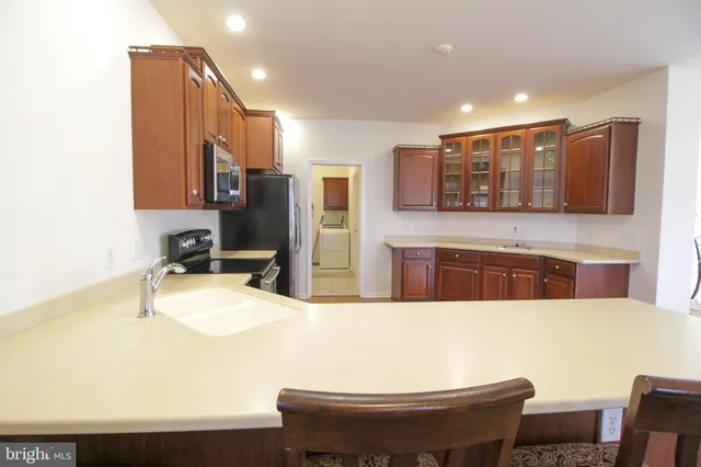 a bathroom with a sink vanity and mirror