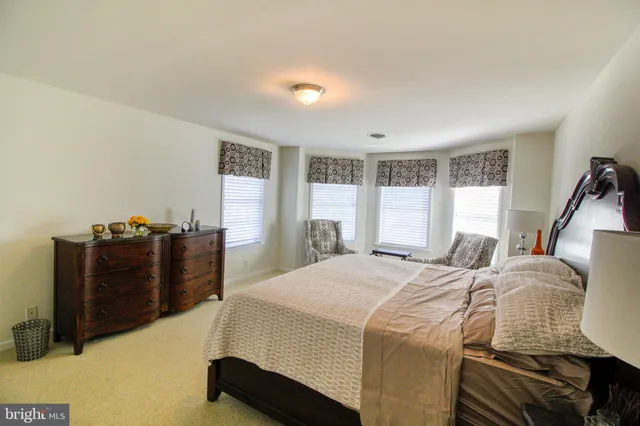 a building outdoor space with patio furniture and garden