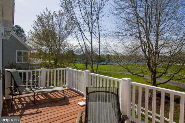 a front view of a house with a lake view