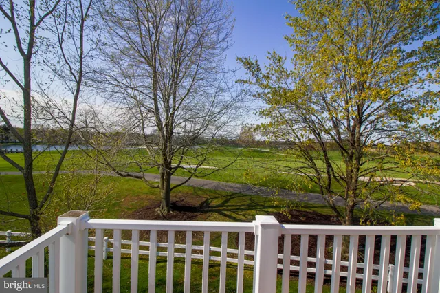 a view of a lake with houses in the back