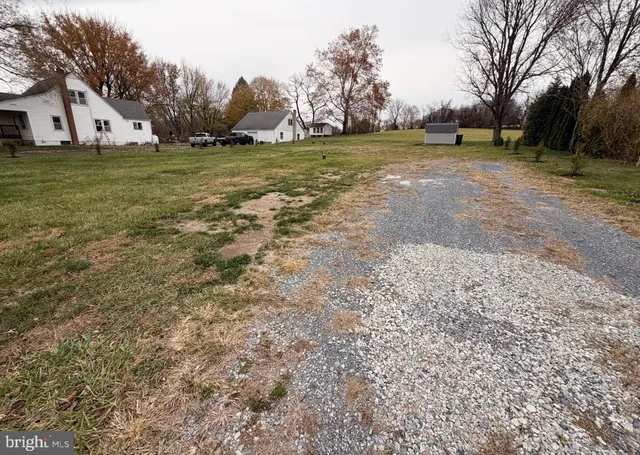 a view of a swimming pool with a yard