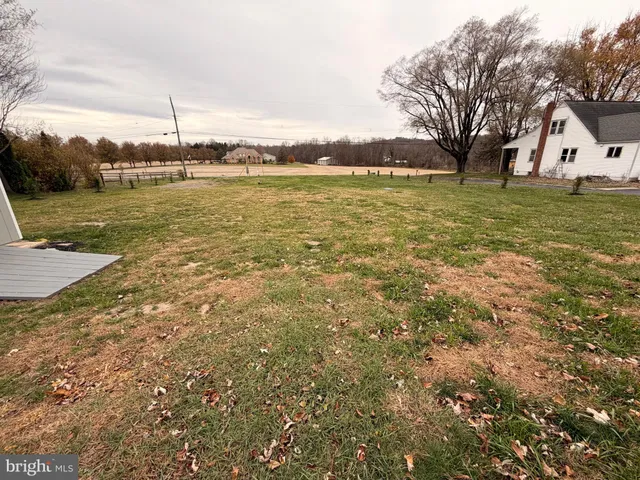 a view of a large body of water with a building in the background