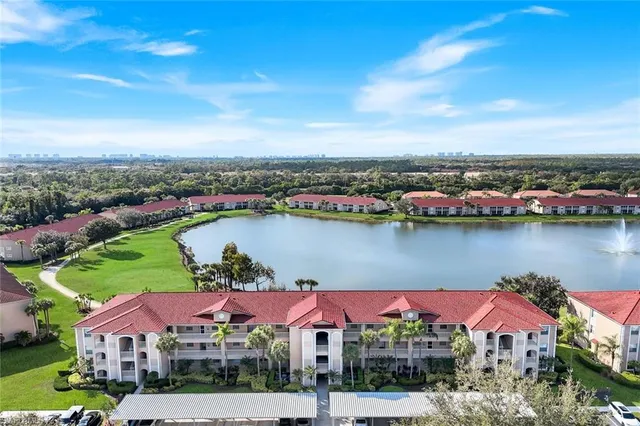 an aerial view of a house with a lake view