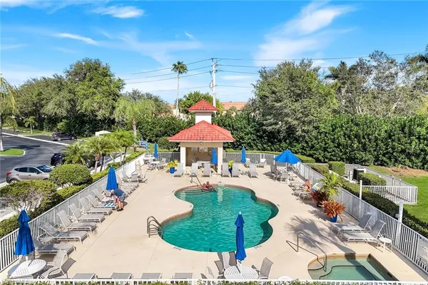 a view of a swimming pool with a patio