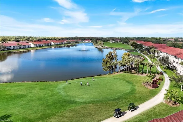 an aerial view of a houses with a lake view
