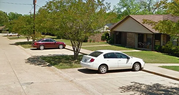 a car parked in front of a house