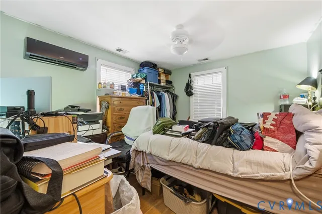 a bedroom with furniture and a chandelier