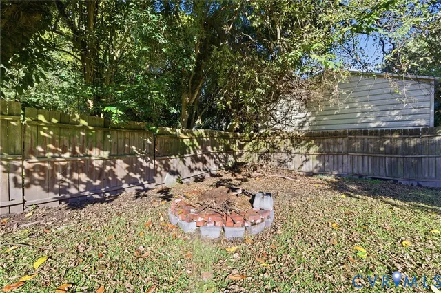a view of a backyard of the house